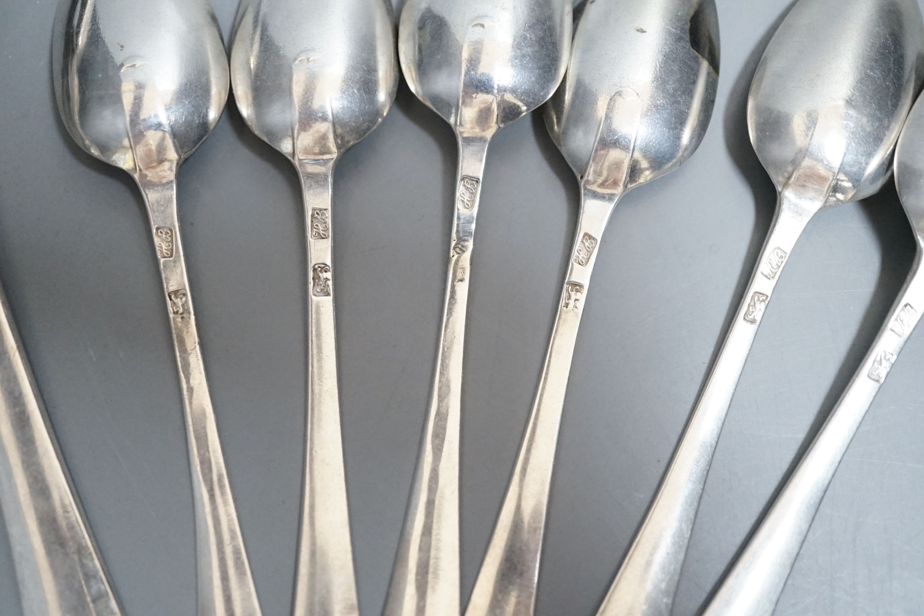 A set of silver George III bright cut engraved silver Old English pattern teaspoons, by Hester Bateman, no date letter and a pair of George III silver bright cut engraved Old English tablespoons, London, 1787